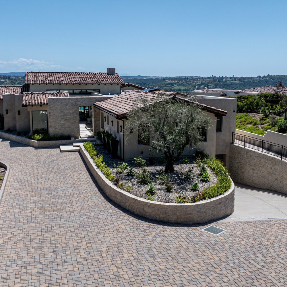 Dedicated cleaner from San Diego House Cleaning Service using eco-friendly products to clean a spacious living room in Bankers Hill, CA